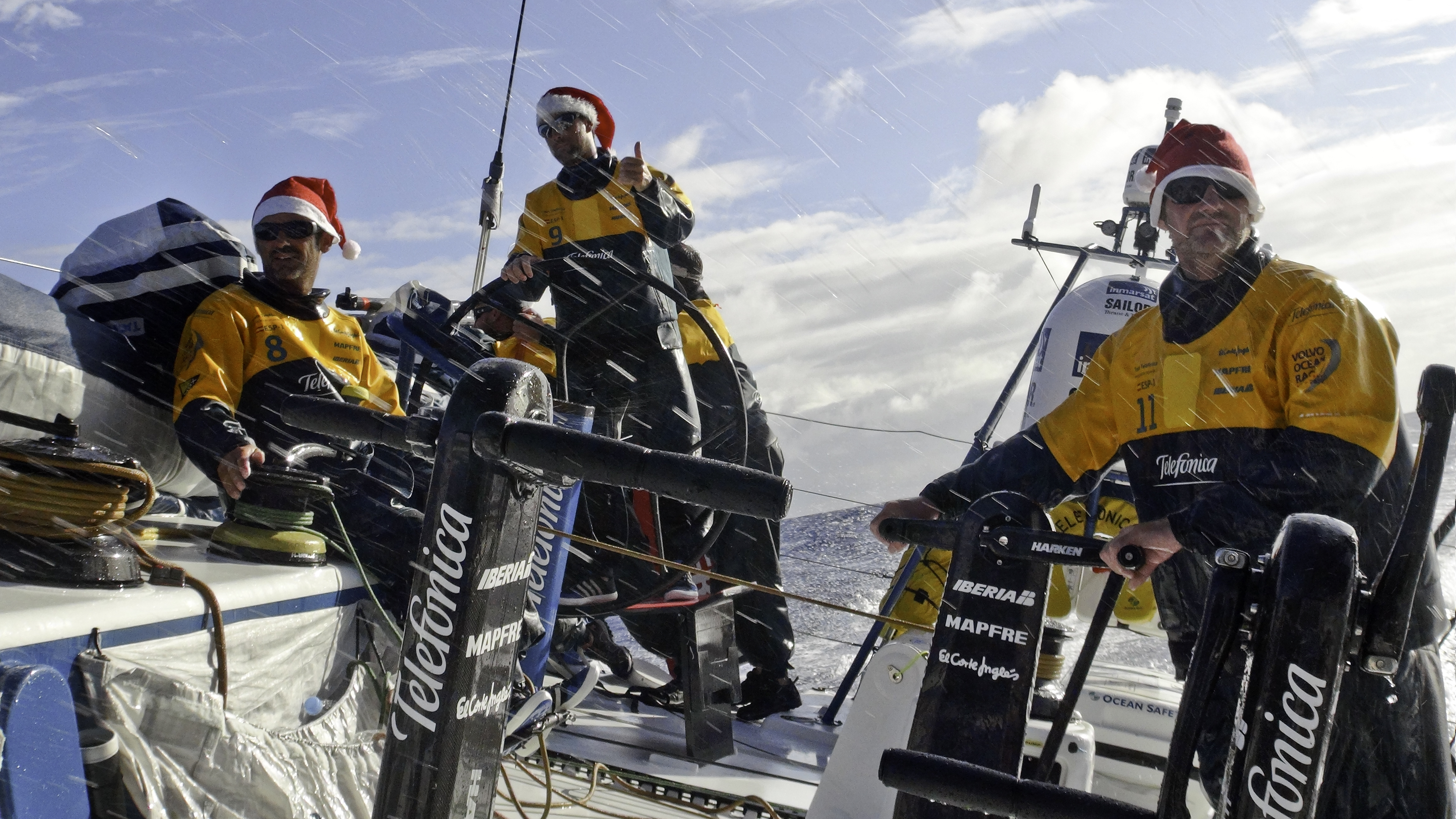 Jordi Calafat from Spain, skipper Iker Martinez from Spain and Neal McDonald from the UK celebrate Christmas on board Team Telefonica during leg 2 of the Volvo Ocean Race 2011-12, from Cape Town, South Africa to Abu Dhabi, UAE.
